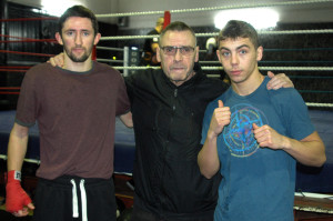 Johnny Eames flanked by new signings Michael O'Rourke (L) and Danny Arnold (R) at the Champions TKO Boxing Gym in London